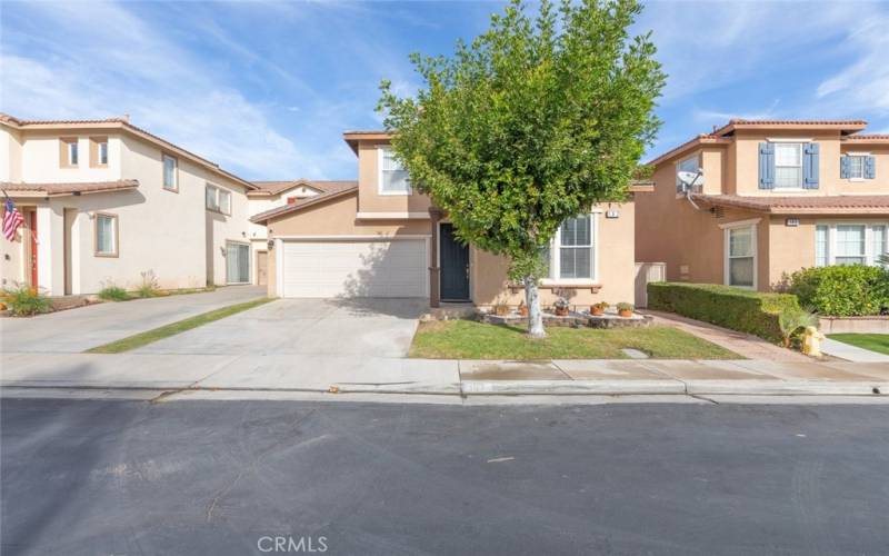 This home showcases inviting curb appeal and offers ample parking space with a wide driveway and two-car garage.