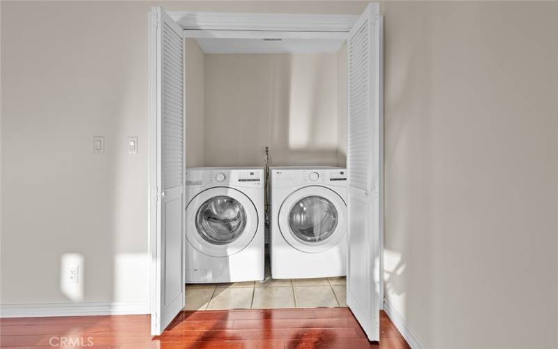 Laundry room with brand new side by side Washer and Dryer