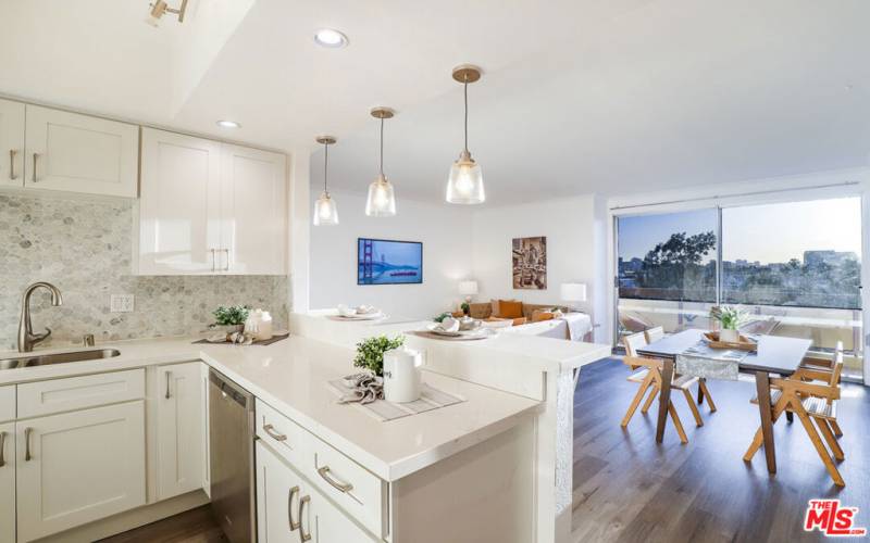 Kitchen overlooking DR, LR w/Rear Balcony