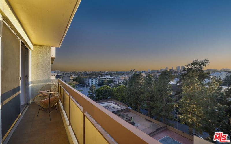 Living Room rear balcony overlooking city