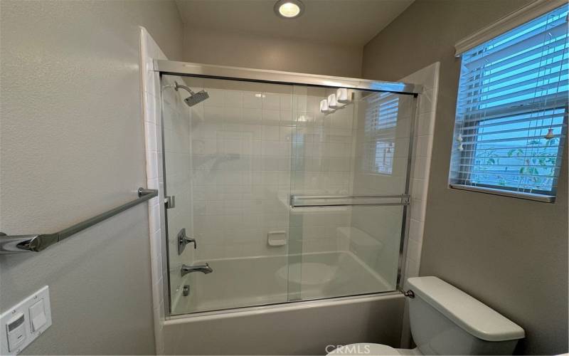 Entry level bathroom in hallway.