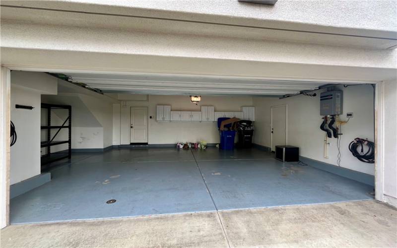 Large 2 car garage with direct entry and Tesla charger in garage.