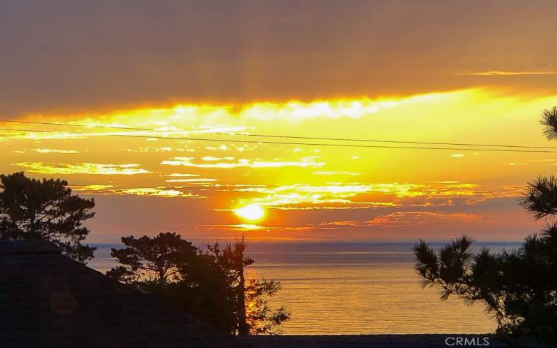 Sunset from Upstairs window ~ distant ocean view