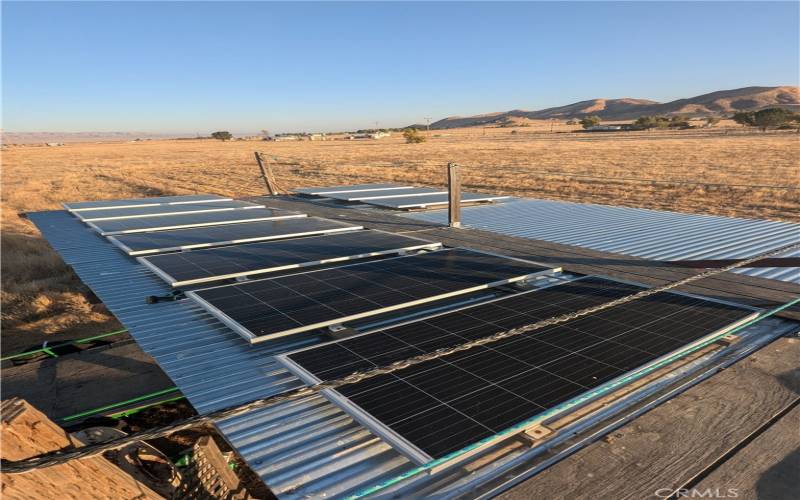 Included solar panels mounted on the pole barn