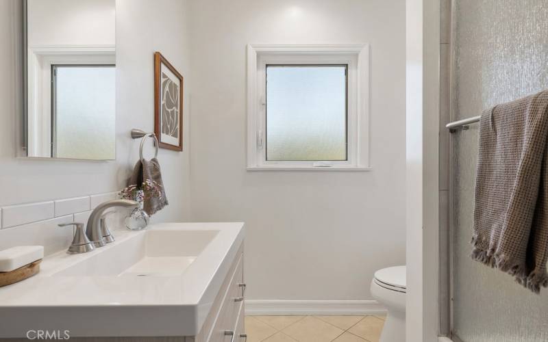 Hallway bathroom with bathtub