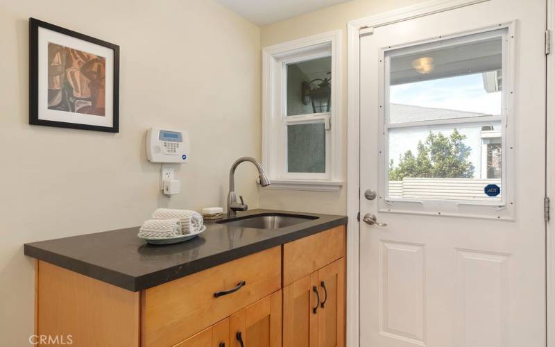 Laundry area with driveway access.