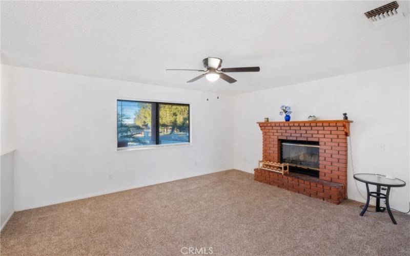 Cozy brick fireplace with mantle!