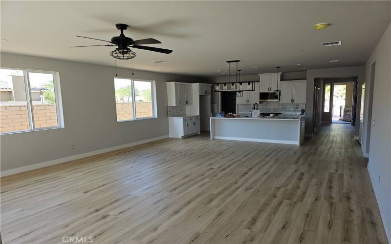 Family room with ceiling fan.