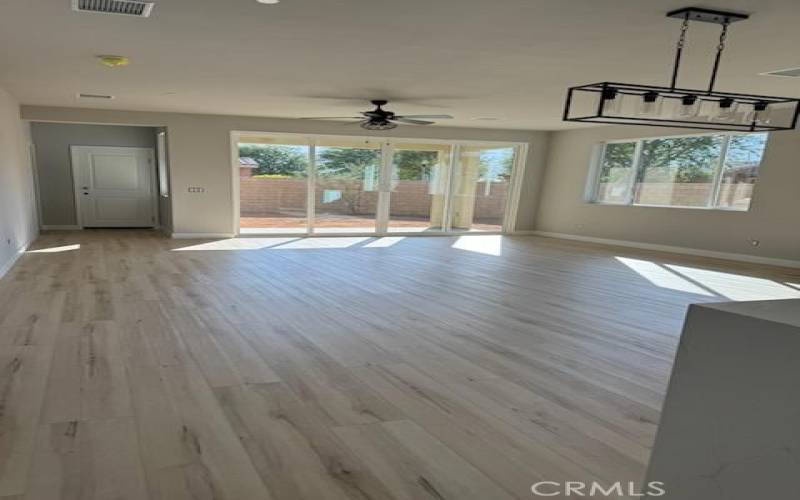 Large family room looking out to the private backyard, lots of natural light.