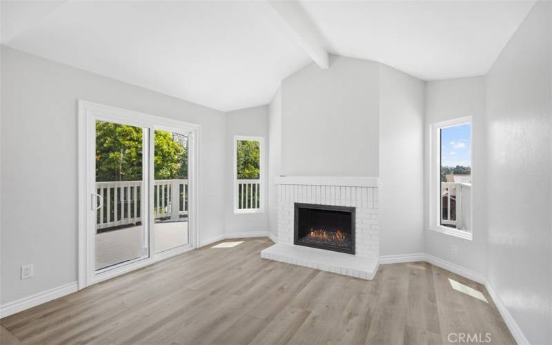 Primary Bedroom with Fireplace and Balcony