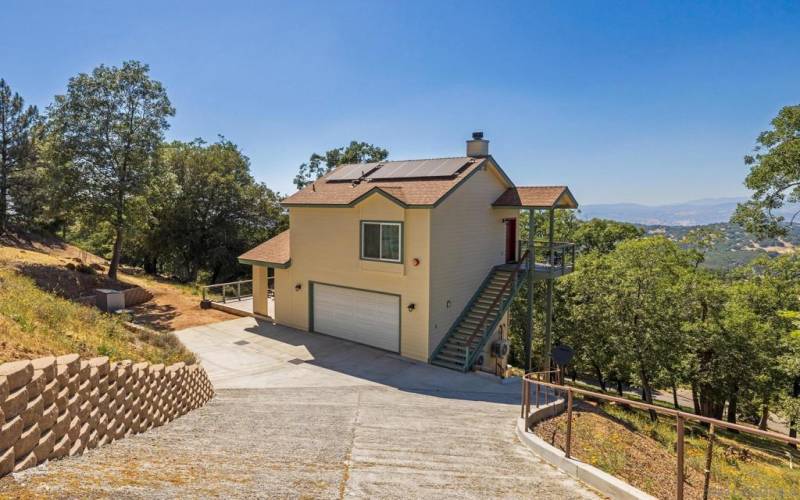 Concrete driveway entry from Oak Grove Drive.