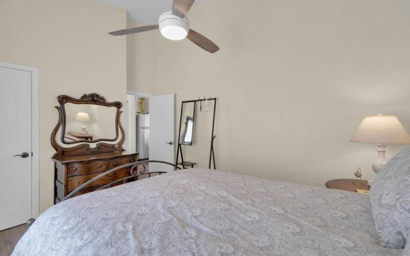 The vaulted ceilings continue into the bedroom.