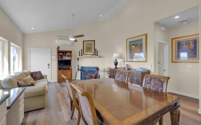 View of the living area and fireplace from the kitchen.