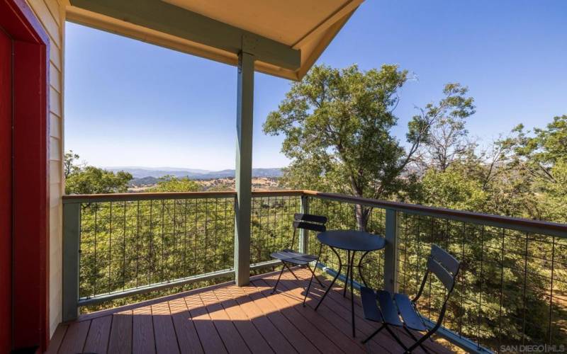 The landing is a perfect deck to sip coffee or enjoy an evening beverage as the sun sets in the distance.