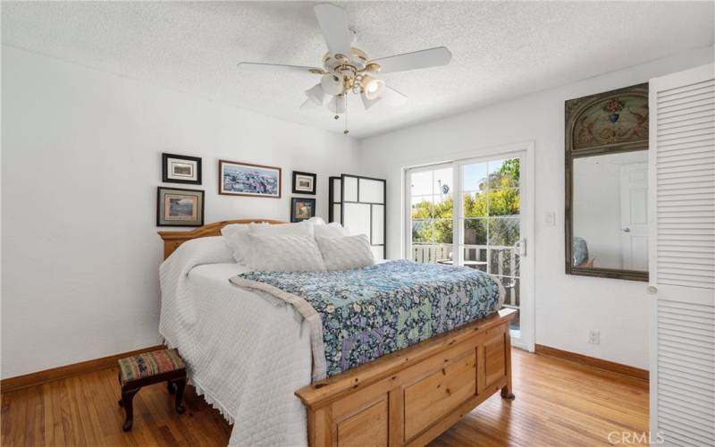 Primary bedroom with french doors out to deck