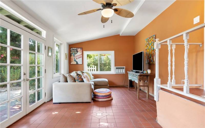 French doors open up to the large backyard