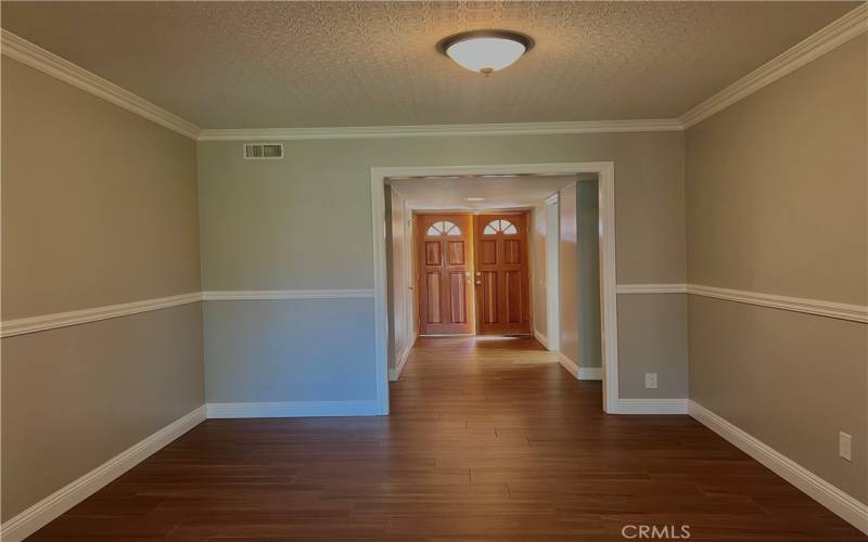 Looking into Formal Dining Room from Enclosed Dining Room