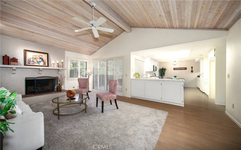 FAMILY ROOM WITH WOOD VAULTED CEILINGS, FIREPLACE AND OPEN TO KITCHEN