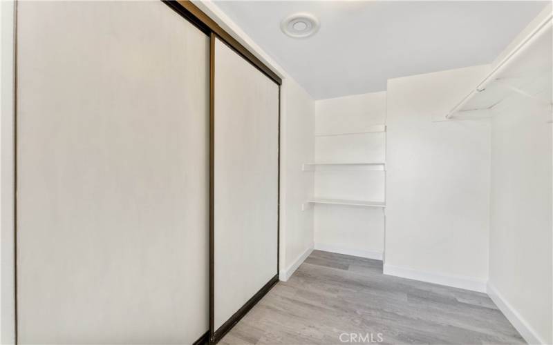 Primary bedroom walk-in closet