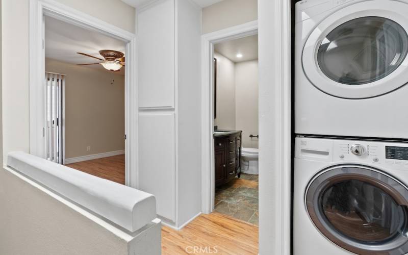 Inside stackable washer & dryer.