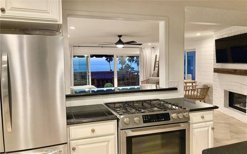 Kitchen open to living room, view, and breakfast bar