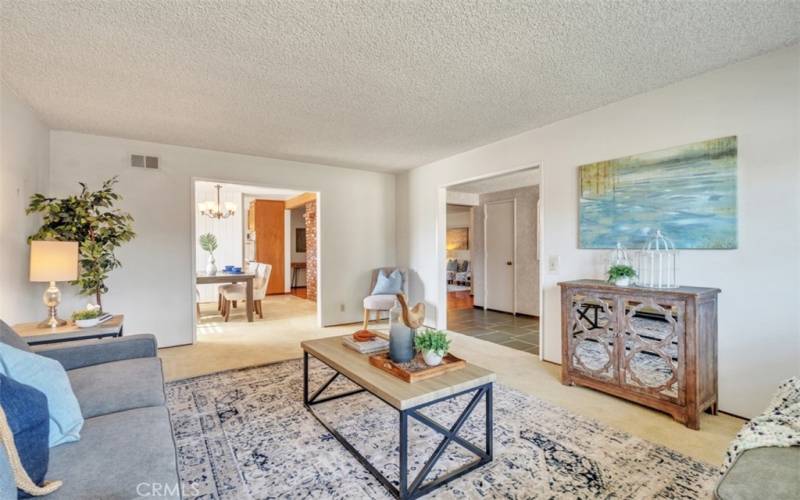 The spacious living room leads into the dining room