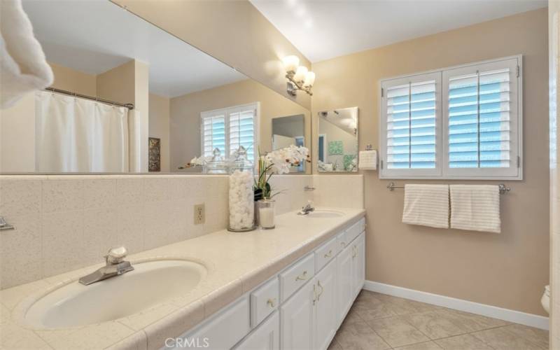 Spacious hall bathroom features dual sinks and lots of counter space