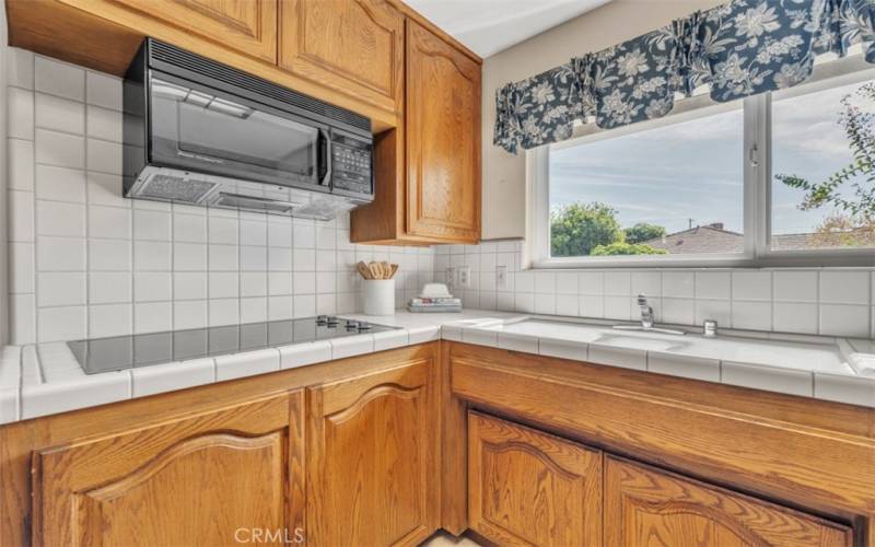 Kitchen offers modern conveniences, cooktop, microwave & dishwasher