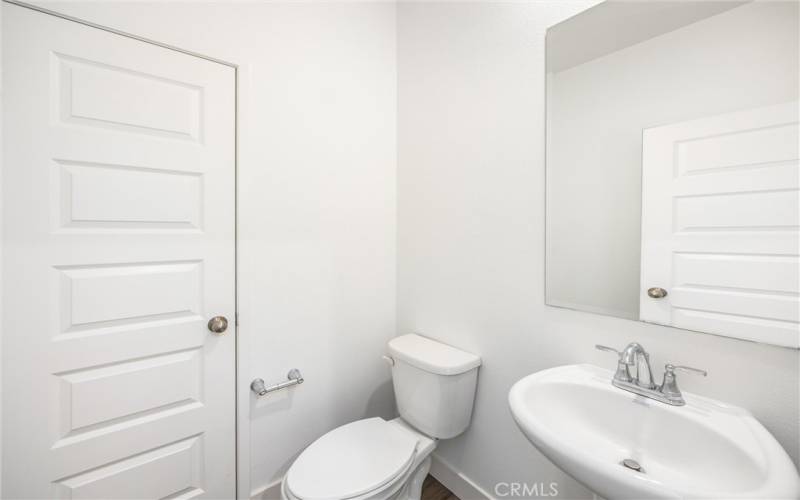 Half guest bath on 1st floor. Potential space for shower.