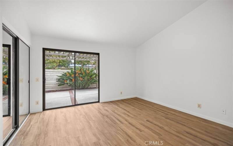 Primary bedroom with a view of the patio.