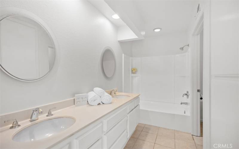 Large primary bathroom with double sinks.