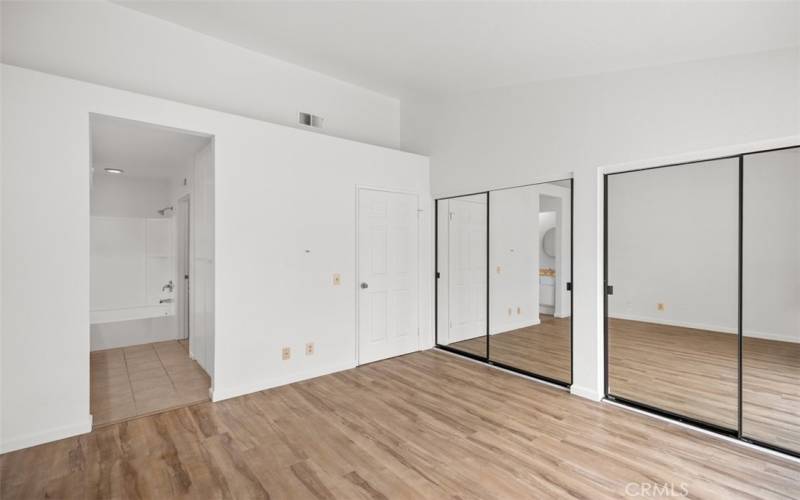 Mirrored closets in the primary bedroom.