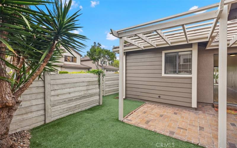 Wrap around patio that leads to the front.