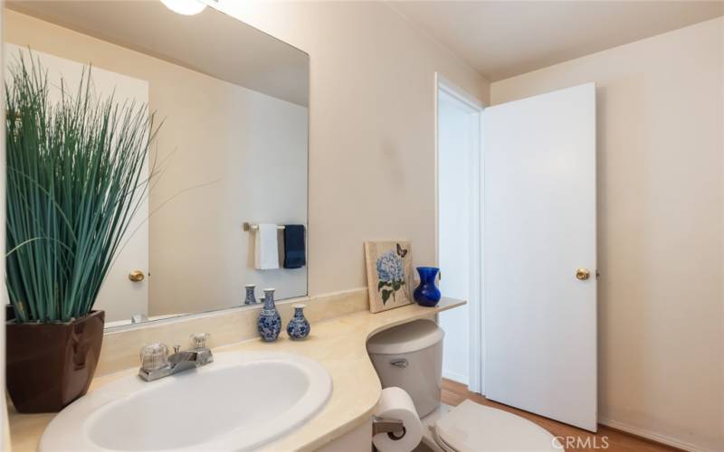 powder room (under the stairs) going back towards the front door