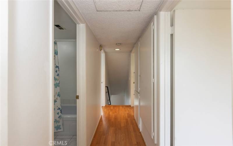 hallway from the back bedrooms back towards the stairs