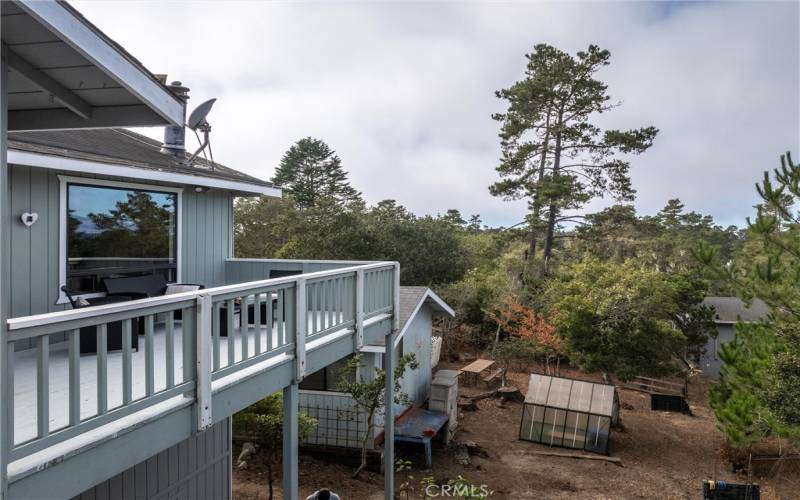 Another drone view of deck and carport with office/studio.