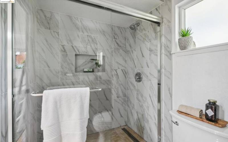 Walk-in shower in the primary bathroom.