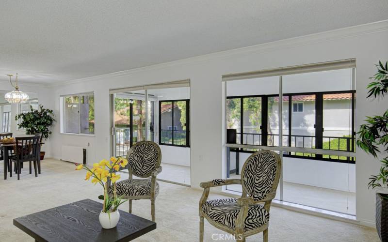 View from the living room toward the enclosed patio and dining room