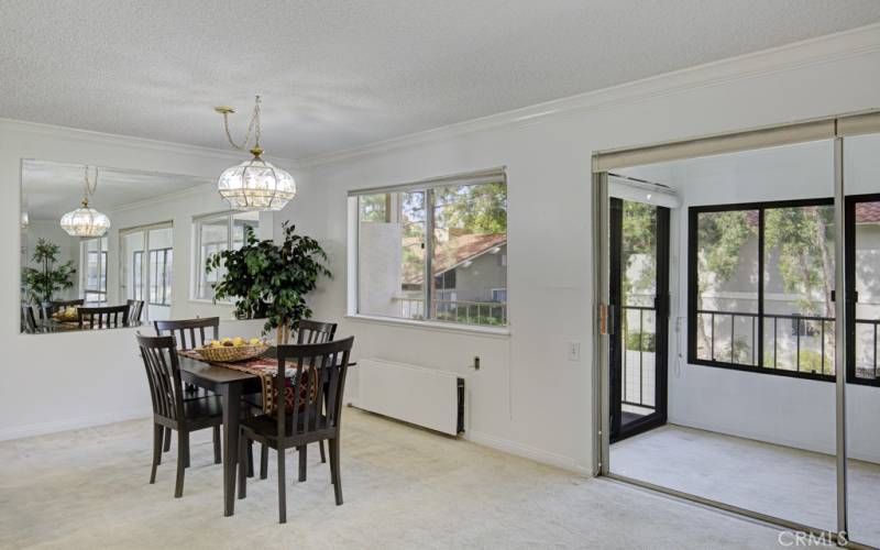 Dining Room has a large mirror and lovely chandellier.