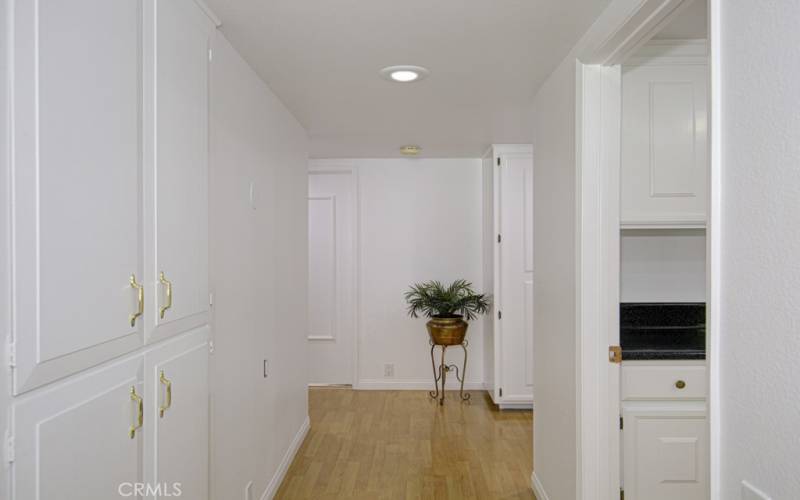 Turn down the hall toward the bedrooms and there are some lovely storage cabinets here for linens and coats.