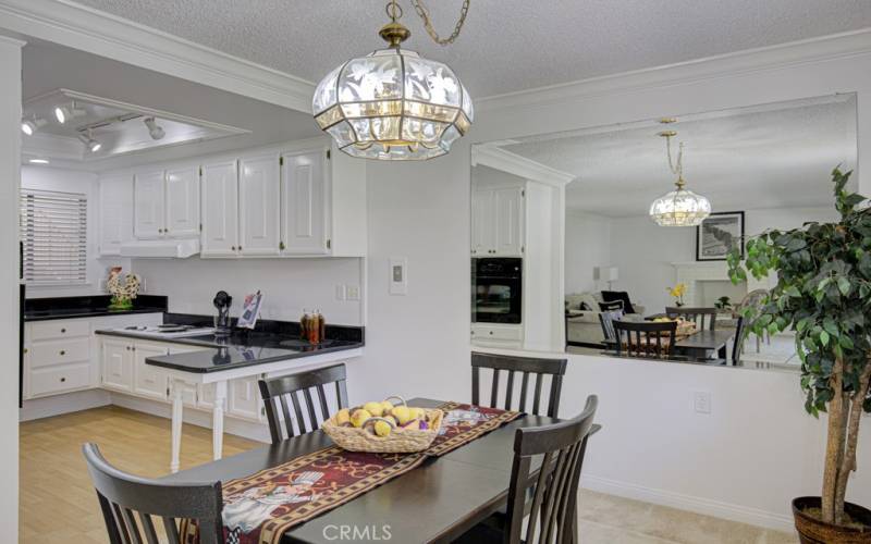 View from the dining area into the fresh, clean kitchen.