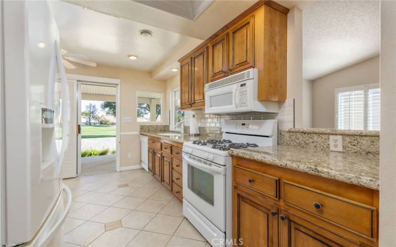 Kitchen showing some nice upgrade's and sliding door to the backyard