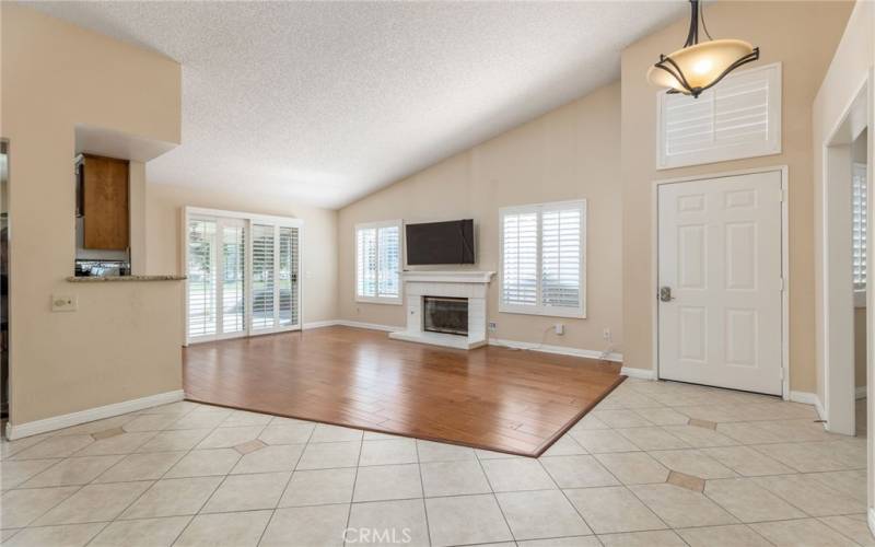 Great Room showing front door and slider to back patio. Notice the plantation shutters.