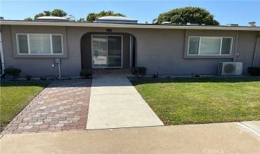 Front of unit. There’s a small covered porch to sit and enjoy the beautiful green belt and some fresh air