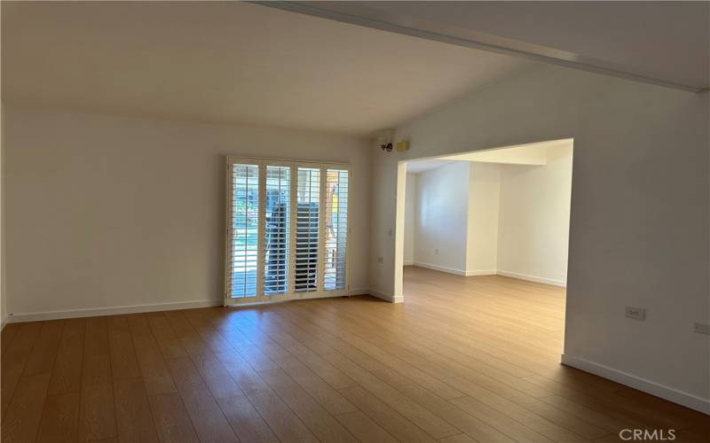 Living Room Unstaged - New Luxury Vinyl woodlike planks just installed throughout unit