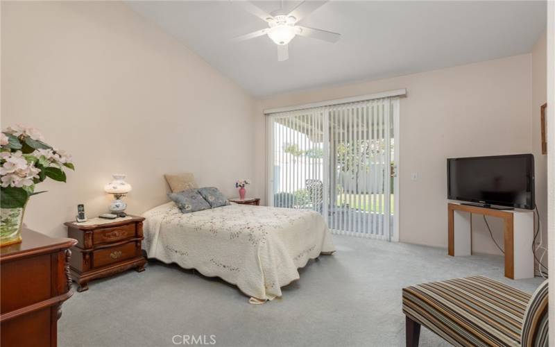 Primary bedroom with access to the patio.