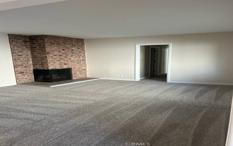 Living Room. Check out artistic finish on fireplace.