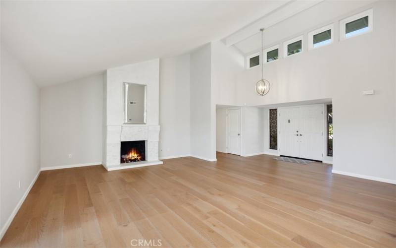 Living room with vaulted ceilings.