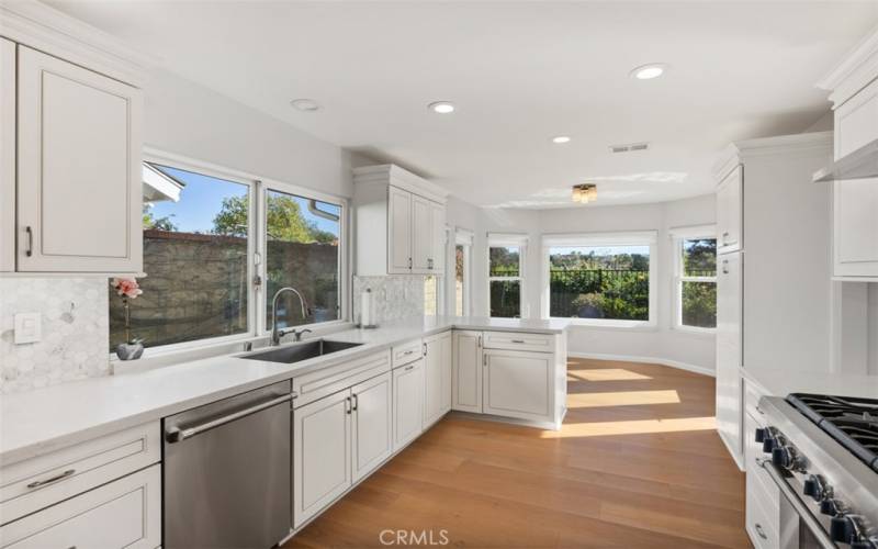 Kitchen flows to the breakfast nook.