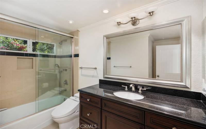 Guest bathroom 2 with tub/shower combo.